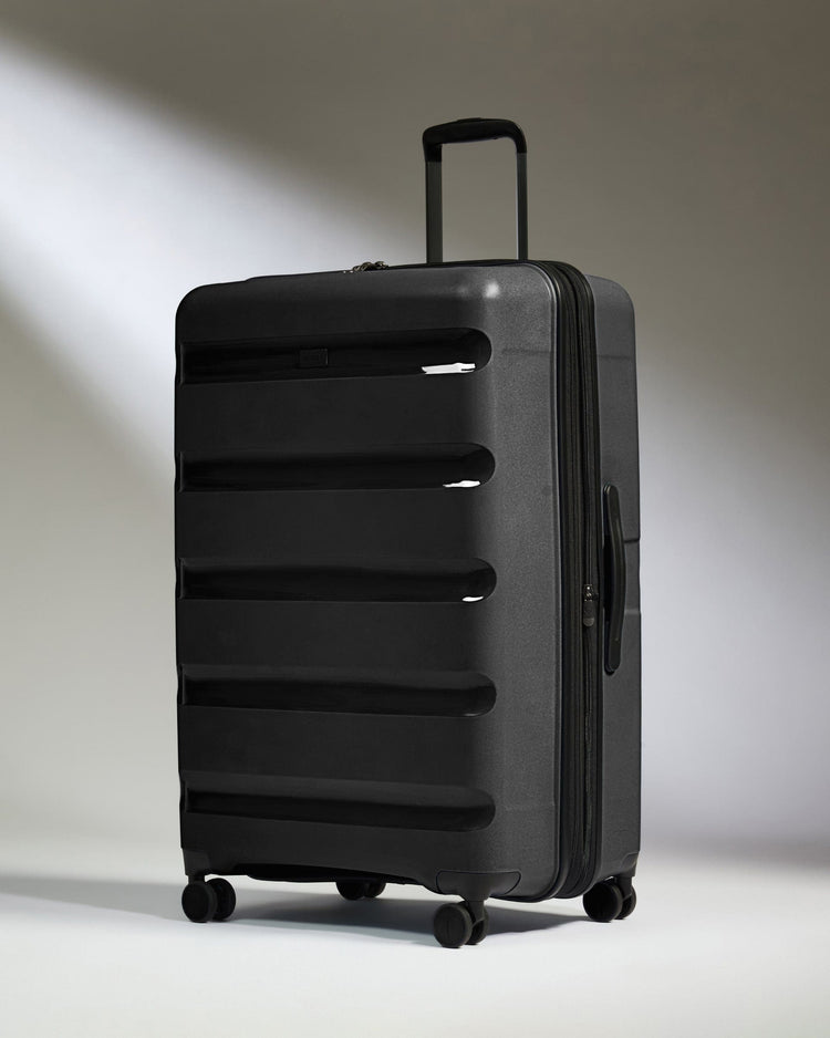 Antler Luggage -  Large Suitcase in Black - Logo Stripe - Hard Suitcase - Large Large Suitcase Black - Logo Stripe | Lightweight Hard Shell Luggage