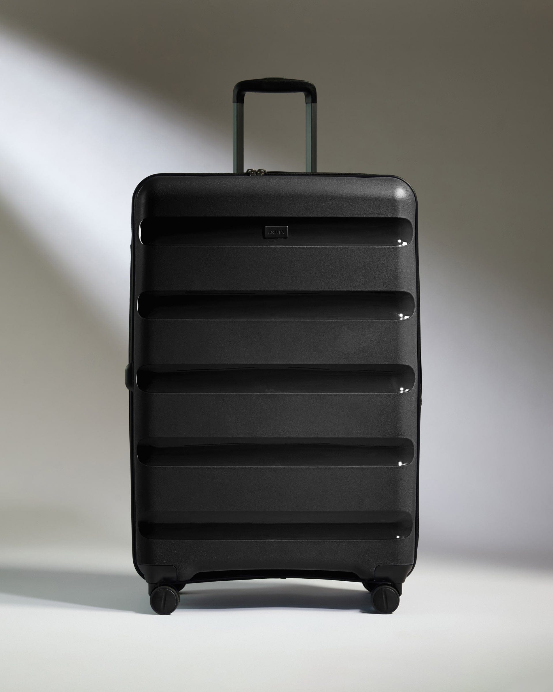 Antler Luggage -  Large Suitcase in Black - Logo Stripe - Hard Suitcase - Large Large Suitcase Black - Logo Stripe | Lightweight Hard Shell Luggage
