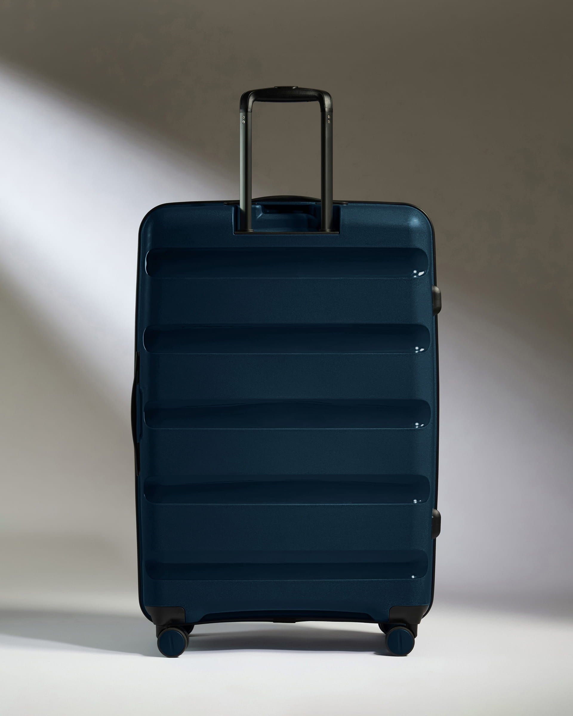 Antler Luggage -  Large Suitcase in Midnight Blue - Logo Stripe - Hard Suitcase - Large Large Suitcase Midnight Blue - Logo Stripe | Lightweight Hard Shell Luggage