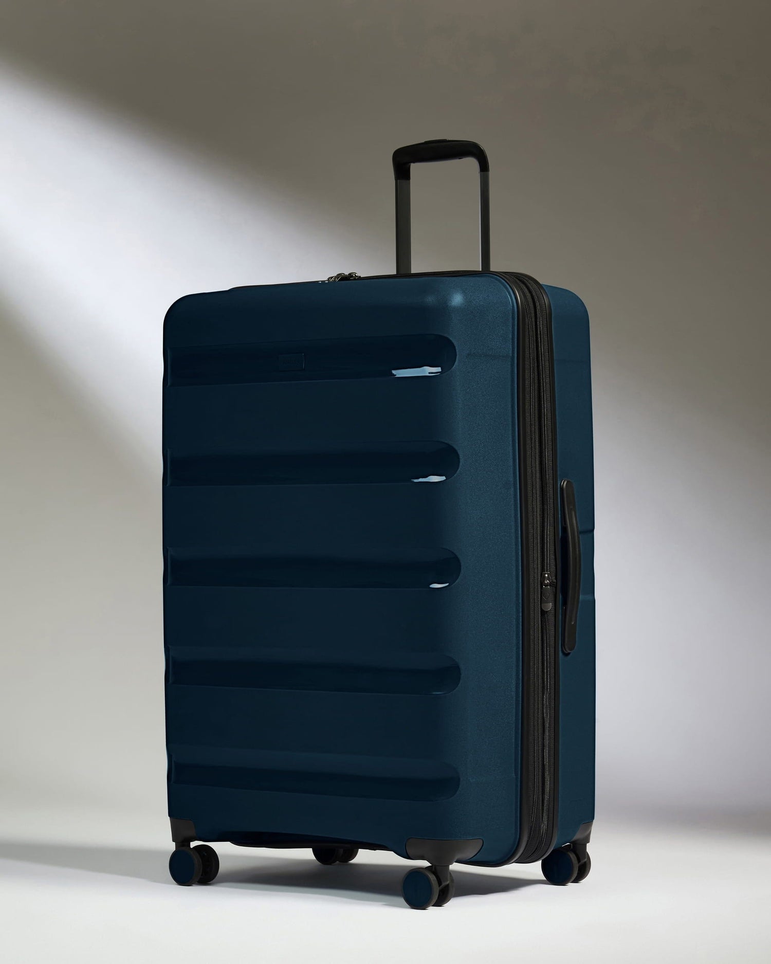 Antler Luggage -  Large Suitcase in Midnight Blue - Logo Stripe - Hard Suitcase - Large Large Suitcase Midnight Blue - Logo Stripe | Lightweight Hard Shell Luggage