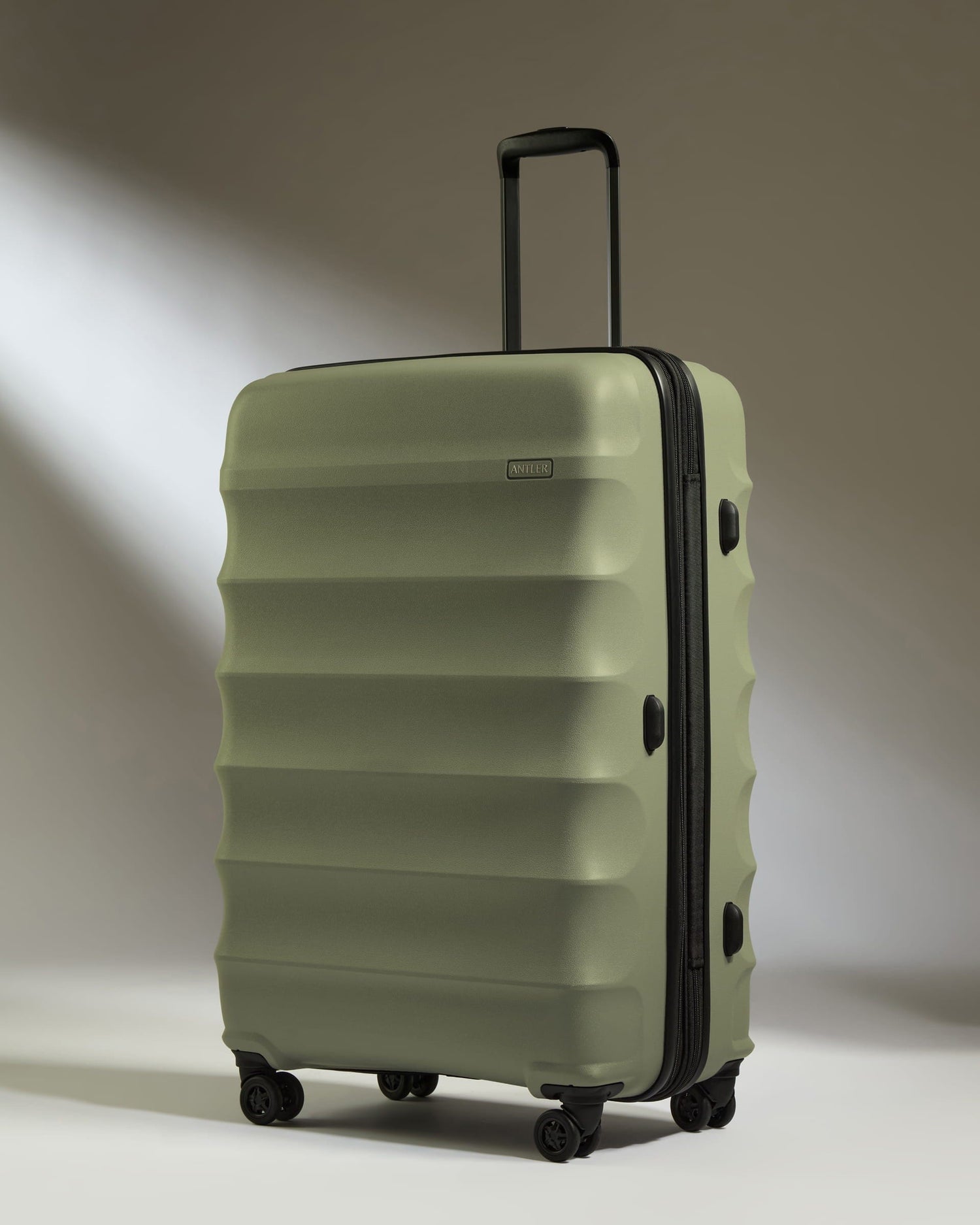 Antler Luggage -  Large Suitcase in Olive Green - Juno - Hard Suitcase Large Suitcase in Olive Green - Juno | Checked Luggage & Large Suitcases