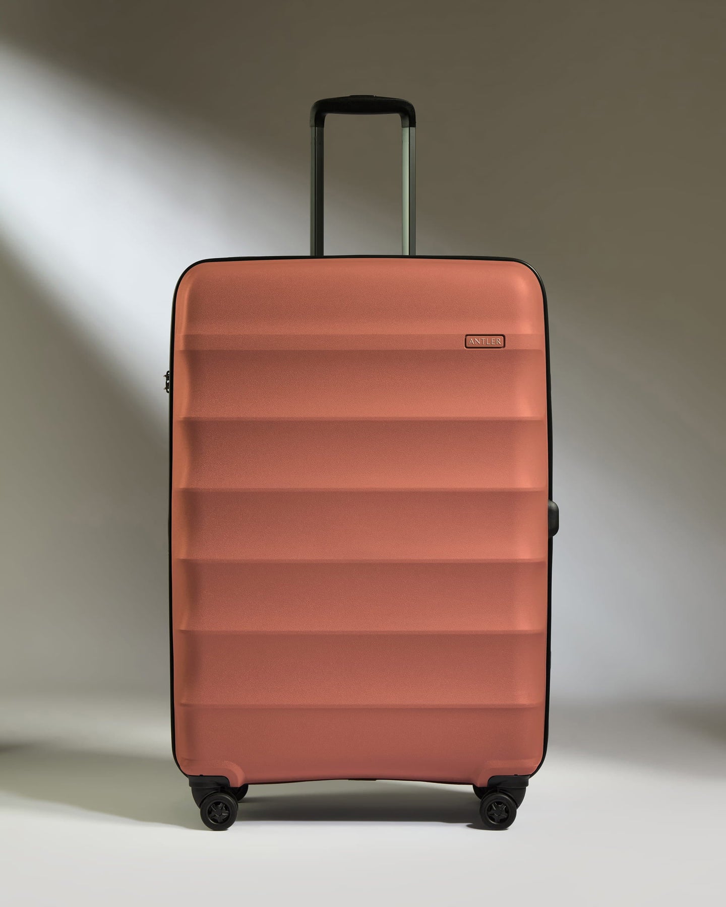 Antler Luggage -  Large Suitcase in Soft Orange - Juno - Hard Suitcase Large Suitcase in Soft Orange - Juno | Checked Luggage & Large Suitcases