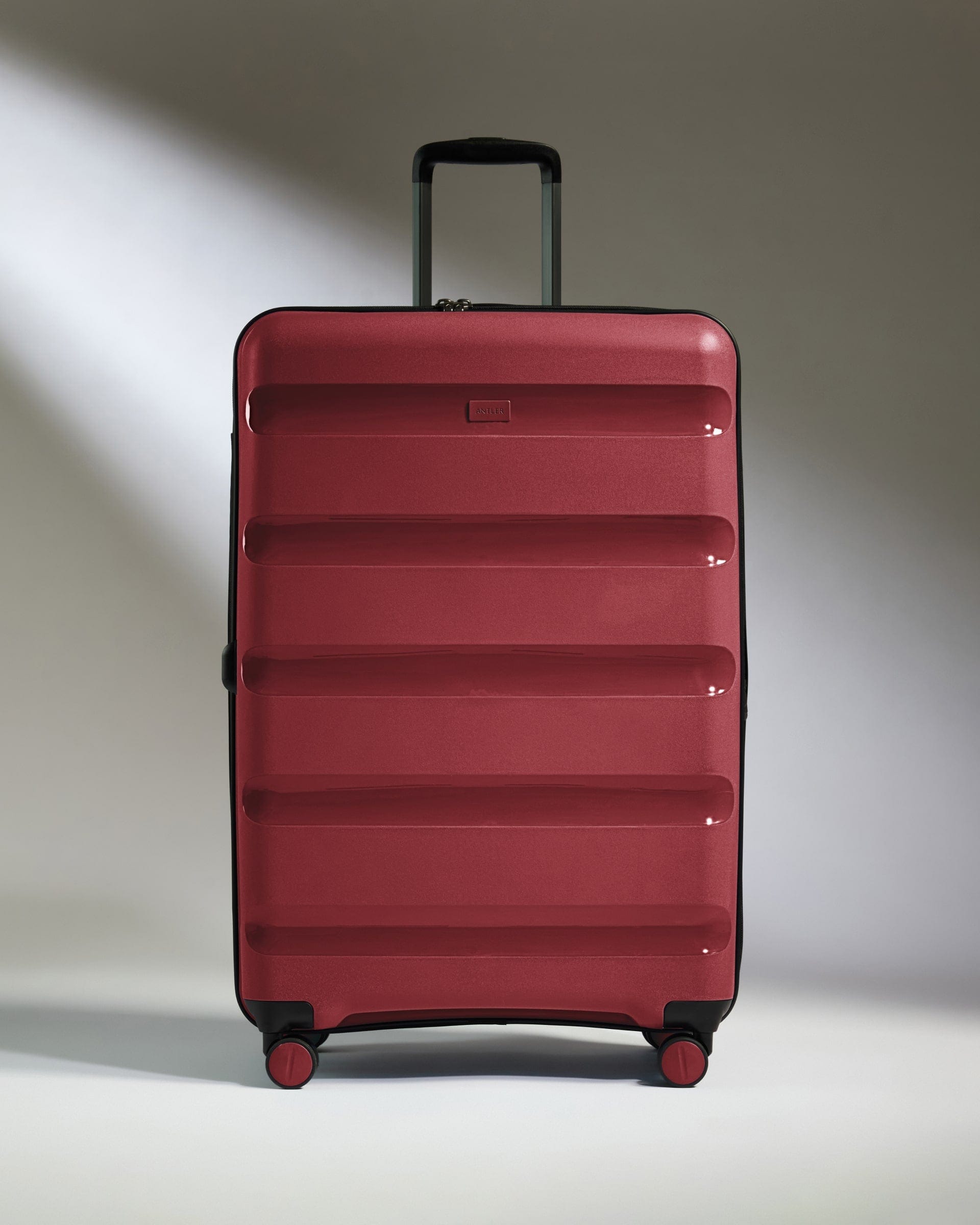 Antler Luggage -  Large Suitcase in Soft Red - Logo Stripe - Hard Suitcase - Large Large Suitcase Red - Logo Stripe | Lightweight Hard Shell Luggage