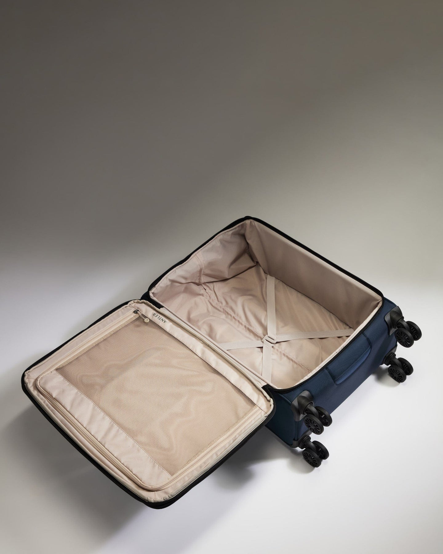 Antler Luggage -  Lightest Medium Suitcase in Indigo Blue - Soft Stripe 2.0 - Soft Suitcase Lightest Medium Suitcase in Navy - Soft Stripe 2.0 | Soft Suitcase