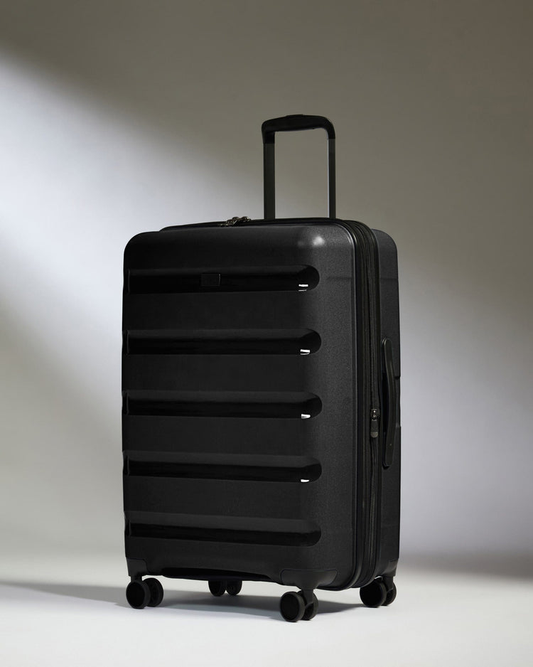 Antler Luggage -  Medium Suitcase in Black - Logo Stripe - Hard Suitcase - Medium Medium Suitcase Black - Logo Stripe | Lightweight Hard Shell Luggage