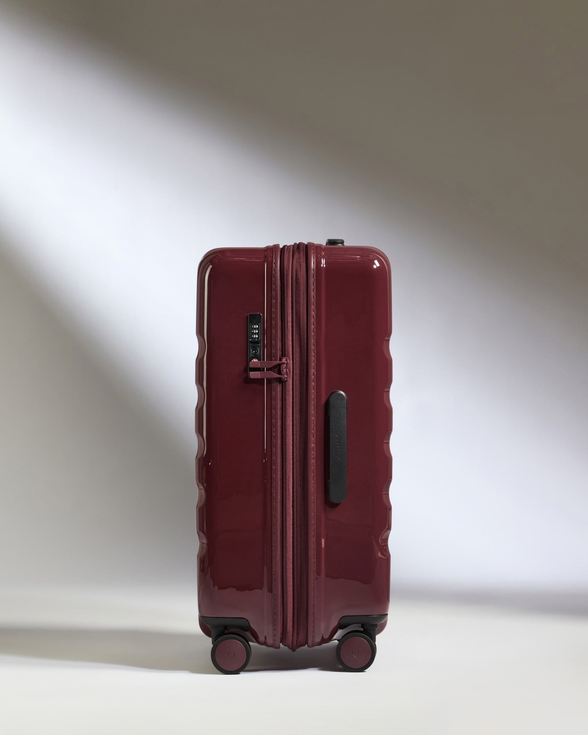 Antler Luggage -  Medium Suitcase in Cedar Red Gloss - Icon Stripe - Hard Suitcase Medium Suitcase in Red Gloss - Icon Stripe | Lightweight & Hard Shell Suitcase