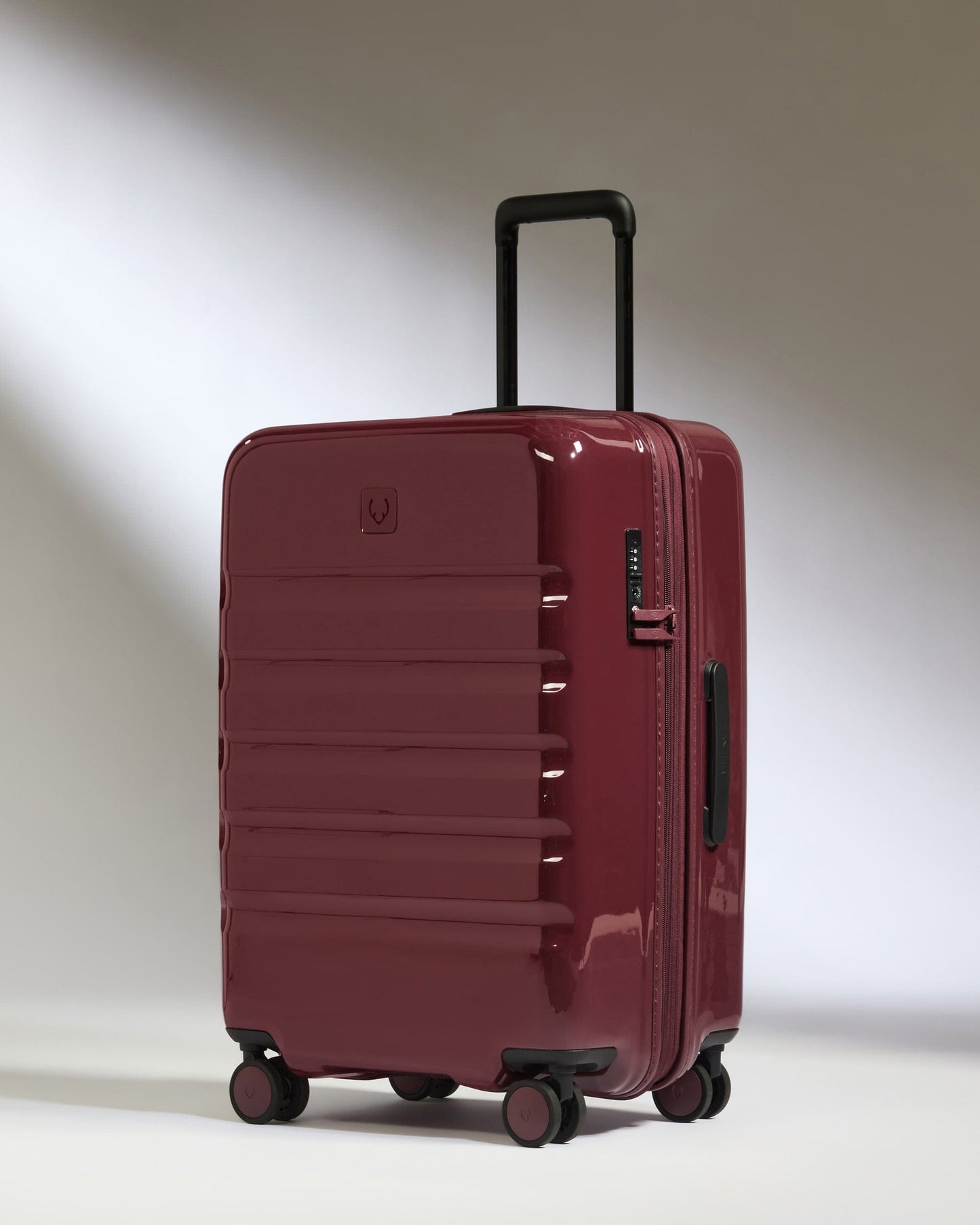Antler Luggage -  Medium Suitcase in Cedar Red Gloss - Icon Stripe - Hard Suitcase Medium Suitcase in Red Gloss - Icon Stripe | Lightweight & Hard Shell Suitcase