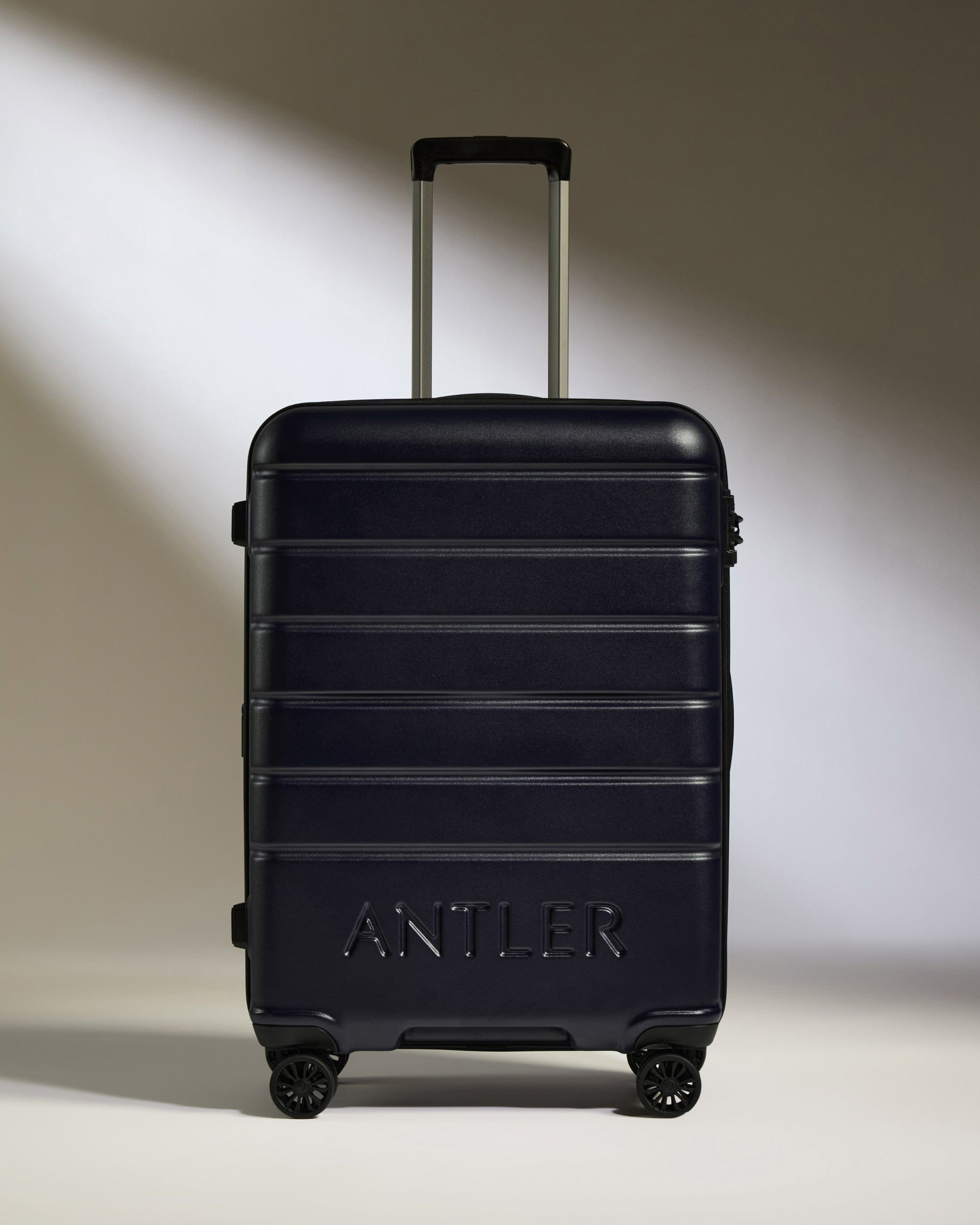 Antler Luggage -  Medium Suitcase in Dark Purple - Logo - Hard Suitcase - Medium Medium Suitcase Dark Purple - Logo | Lightweight Hard Shell Luggage