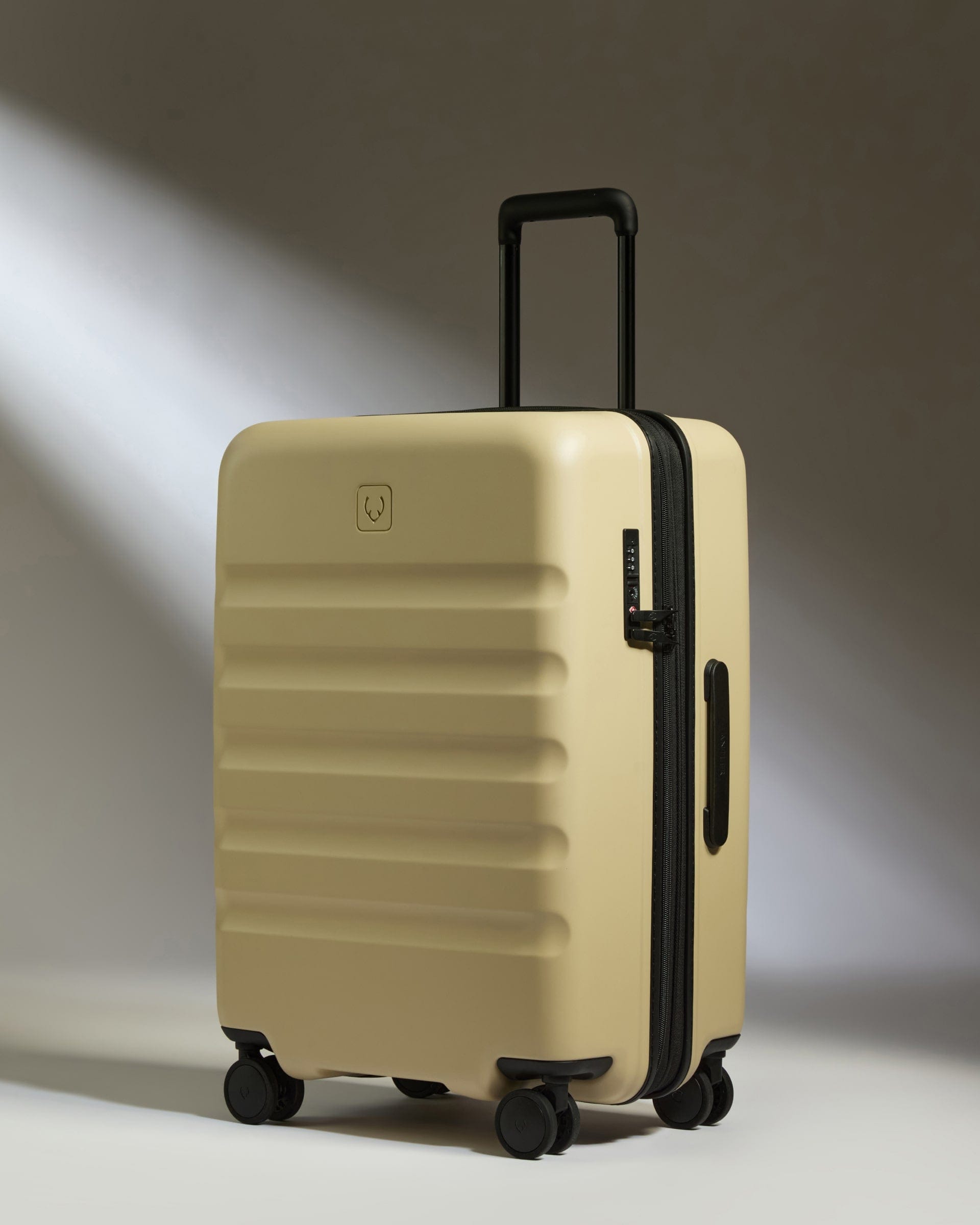 Antler Luggage -  Medium Suitcase in Dune Yellow - Icon Stripe - Hard Suitcase Icon Stripe Medium Suitcase in Yellow | Lightweight & Hard Shell Suitcase