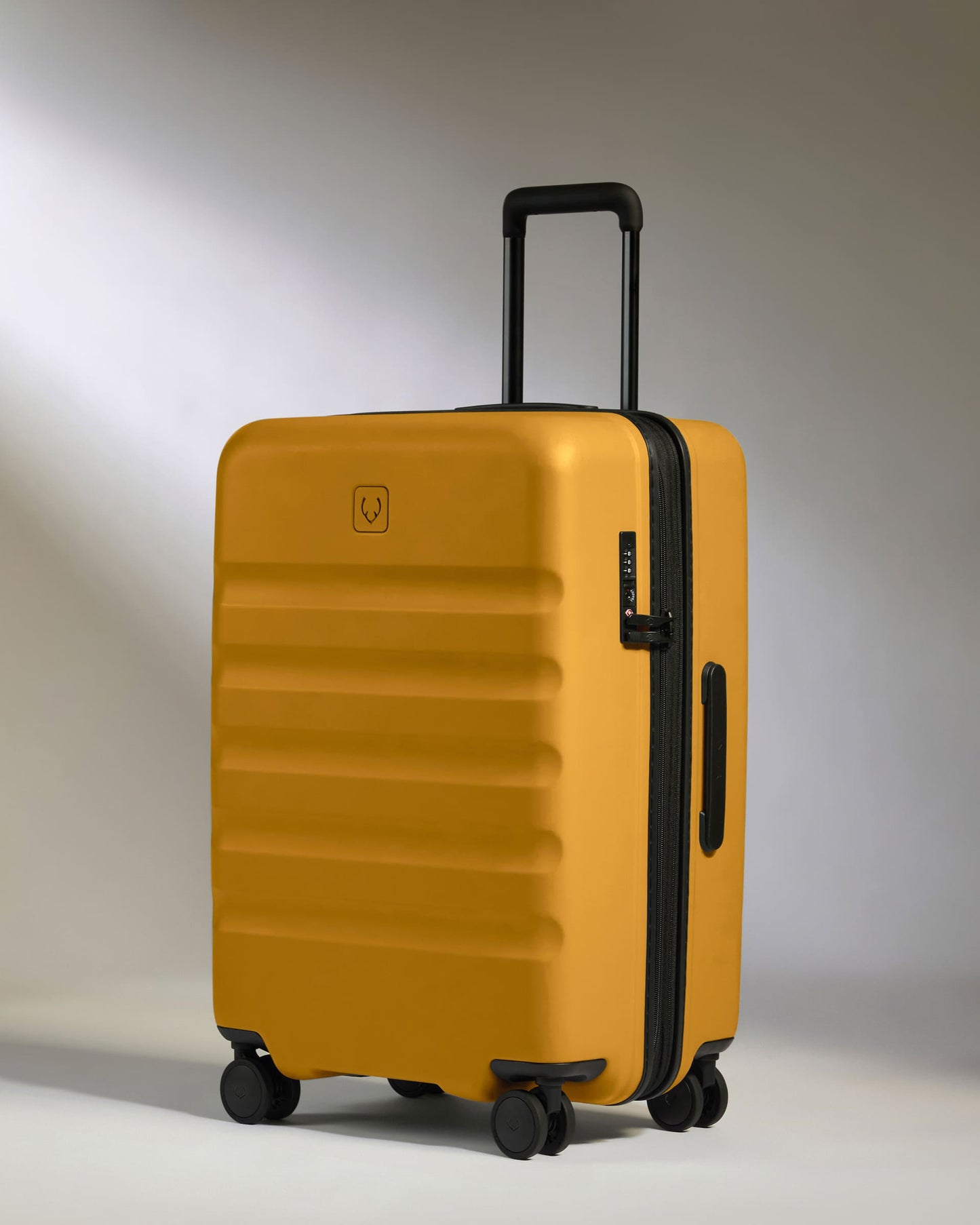 Antler Luggage -  Medium Suitcase in Mustard Yellow - Icon Stripe - Hard Suitcase - Medium Icon Stripe Medium Suitcase in Dark Yellow | Lightweight & Hard Shell Suitcase