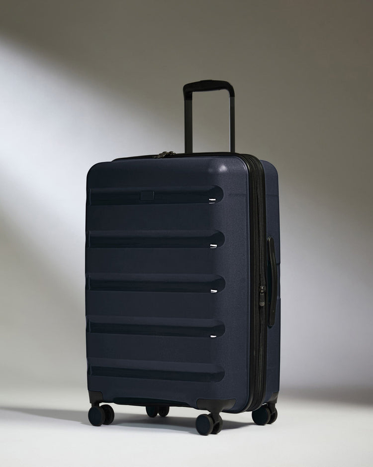 Antler Luggage -  Medium Suitcase in Navy - Logo Stripe - Hard Suitcase - Medium Medium Suitcase Navy - Logo Stripe | Lightweight Hard Shell Luggage