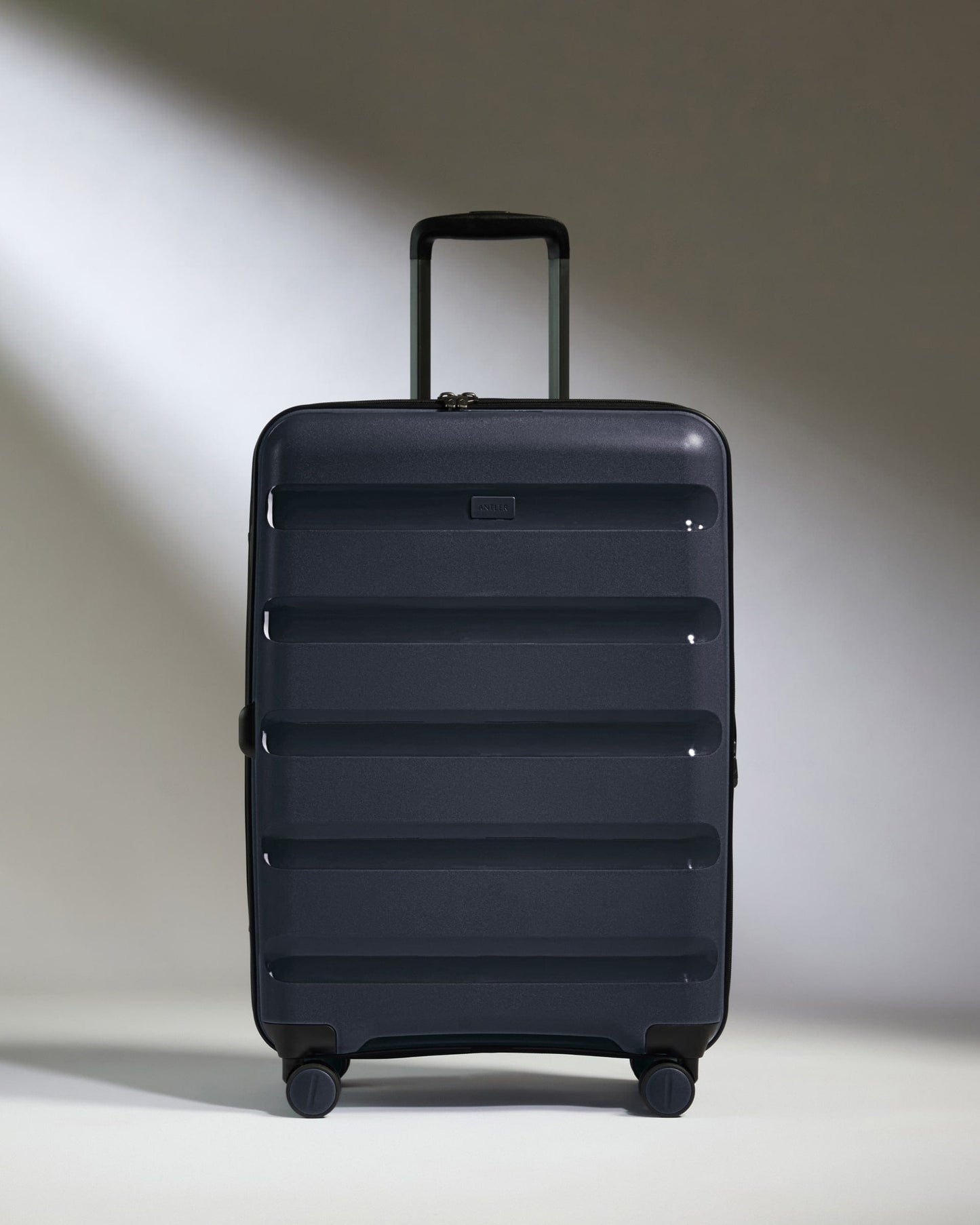 Antler Luggage -  Medium Suitcase in Navy - Logo Stripe - Hard Suitcase - Medium Medium Suitcase Navy - Logo Stripe | Lightweight Hard Shell Luggage