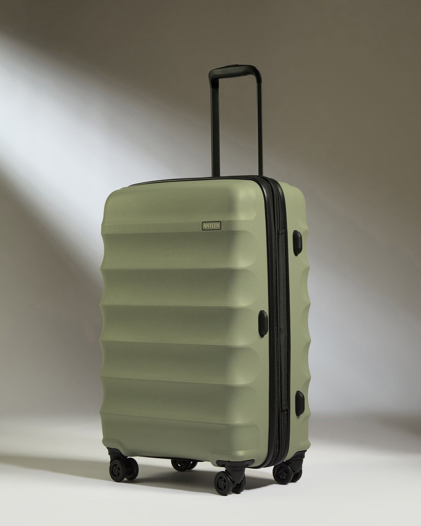Antler Luggage -  Medium Suitcase in Olive Green - Juno - Hard Suitcase Medium Suitcase in Olive Green - Juno | Checked Luggage & Medium Suitcases