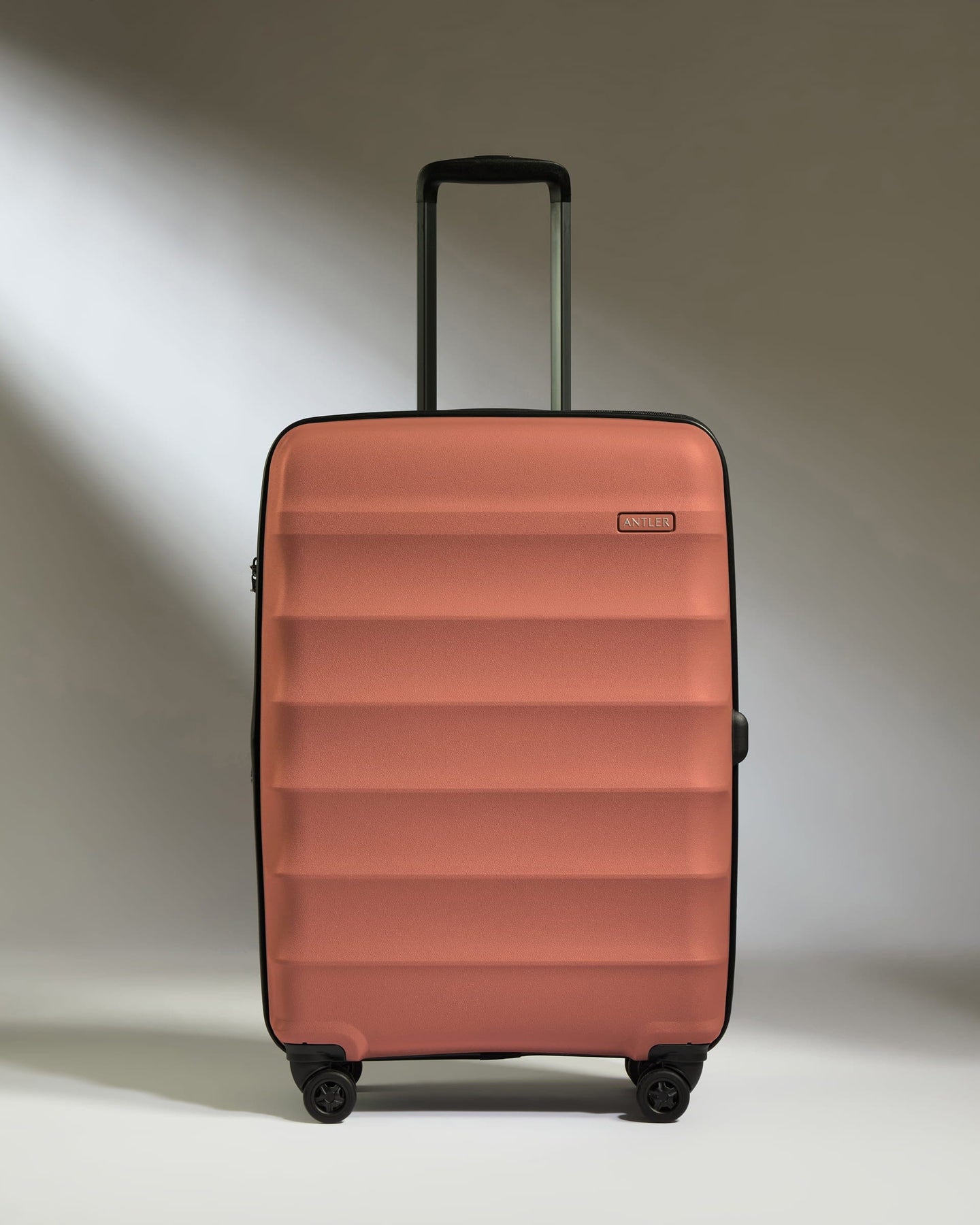 Antler Luggage -  Medium Suitcase in Soft Orange - Juno - Hard Suitcase Medium Suitcase in Soft Orange - Juno | Checked Luggage & Medium Suitcases