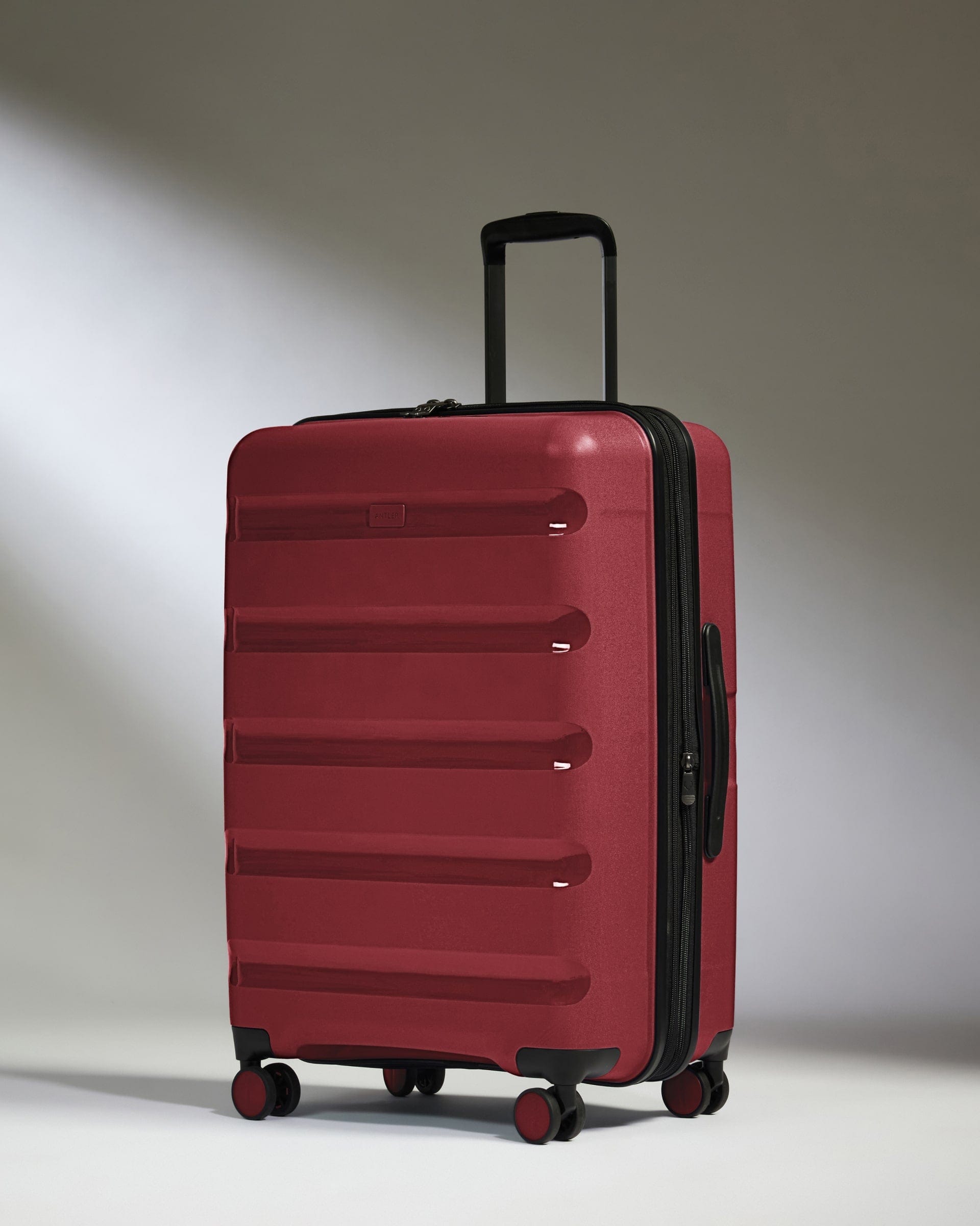 Antler Luggage -  Medium Suitcase in Soft Red - Logo Stripe - Hard Suitcase - Medium Medium Suitcase Red - Logo Stripe | Lightweight Hard Shell Luggage