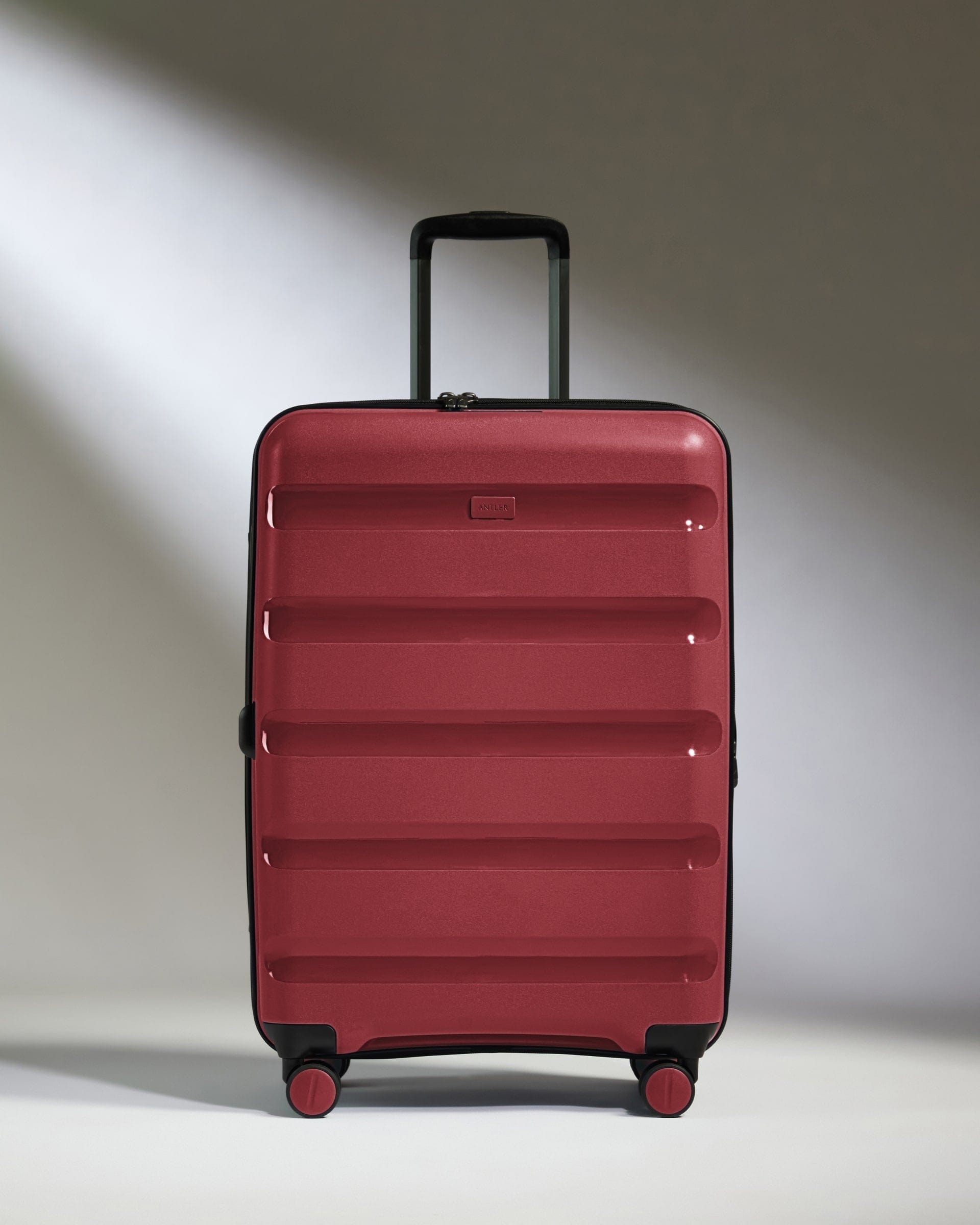 Antler Luggage -  Medium Suitcase in Soft Red - Logo Stripe - Hard Suitcase - Medium Medium Suitcase Red - Logo Stripe | Lightweight Hard Shell Luggage