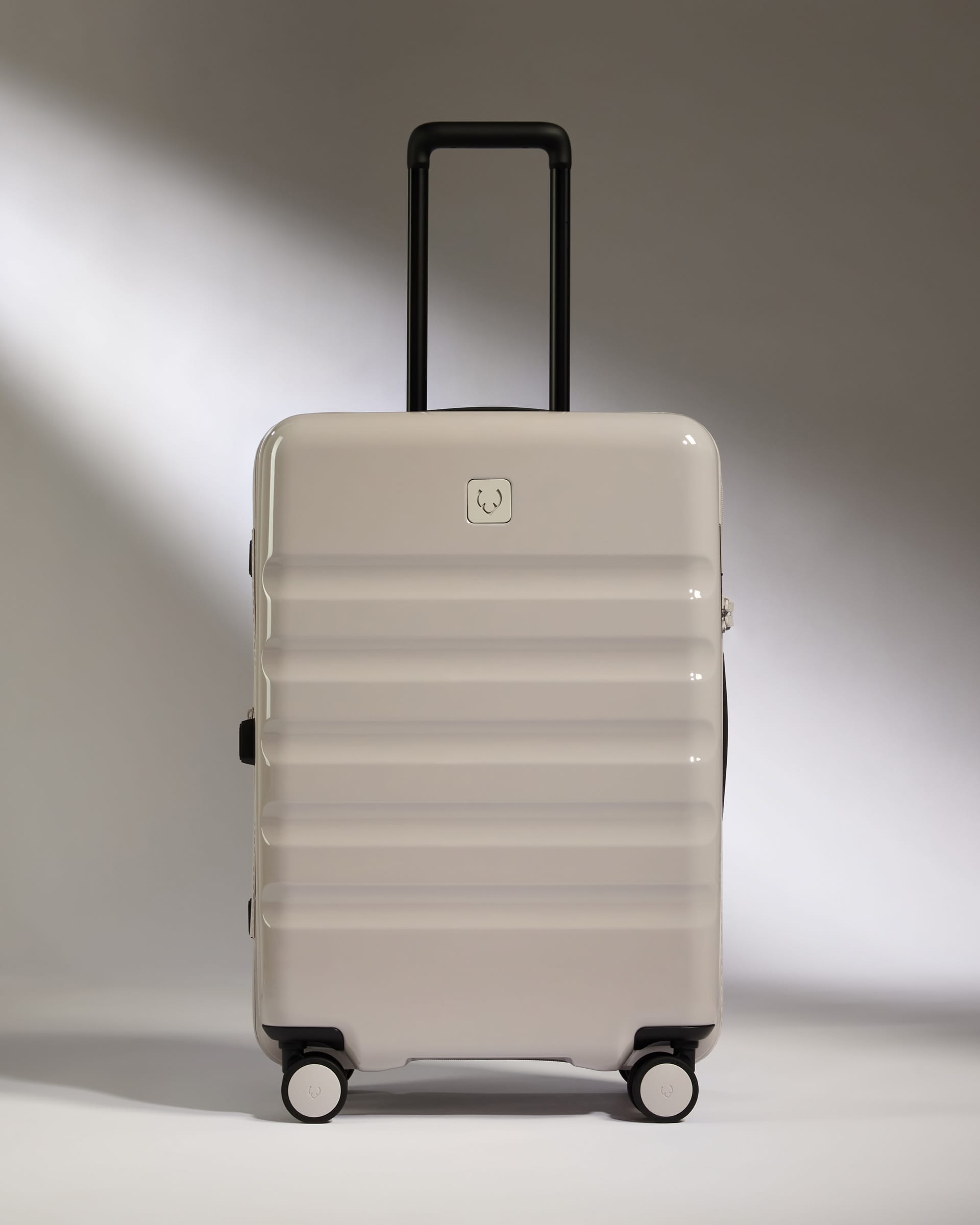 Antler Luggage -  Medium Suitcase in Taupe Gloss - Icon Stripe - Hard Suitcase Medium Suitcase in Taupe Gloss - Icon Stripe | Lightweight & Hard Shell Suitcase