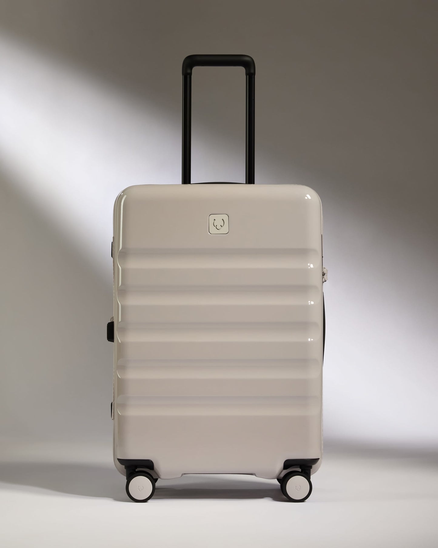 Antler Luggage -  Medium Suitcase in Taupe Gloss - Icon Stripe - Hard Suitcase Medium Suitcase in Taupe Gloss - Icon Stripe | Lightweight & Hard Shell Suitcase