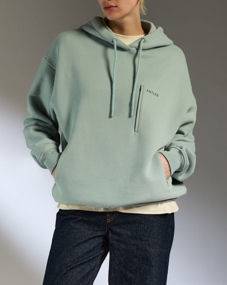 Antler Luggage -  Travel Essential Hoodie in Mist Blue - Apparel Travel Essential Hoodie in Blue | Travel Clothing & Accessories